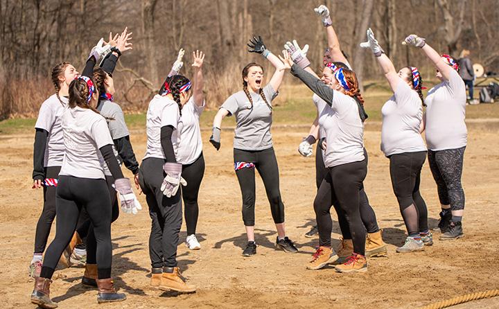 BW students April Reign tug of war team 与 arms raised